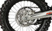 KAYO K4 250 rear 3/4 left angle view showing aluminum swingarm, chain drive, and taillight