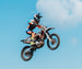 KAYO K6R 250 motocross dirt bike jumping mid-air during off-road competition