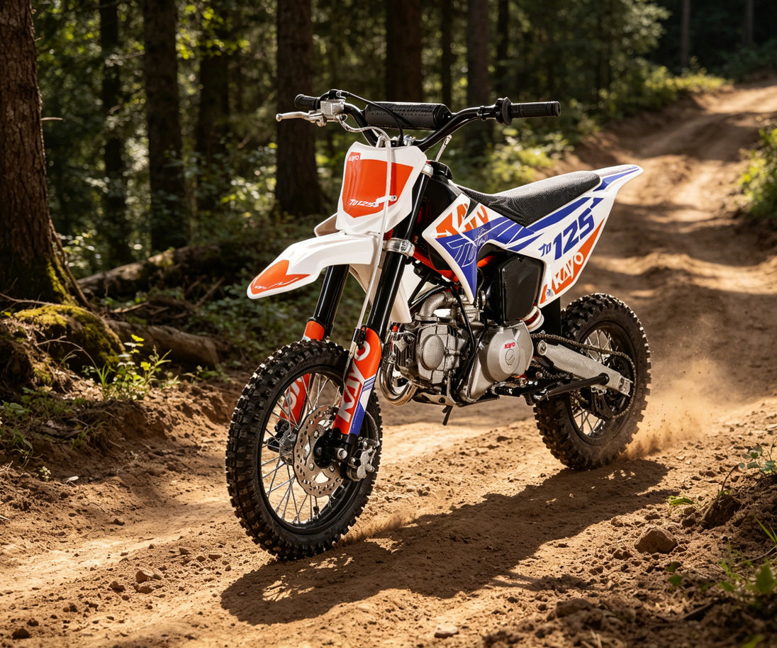 KAYO TD125 trail dirt bike riding on woodland path