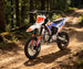 KAYO TD125 trail dirt bike riding on woodland path